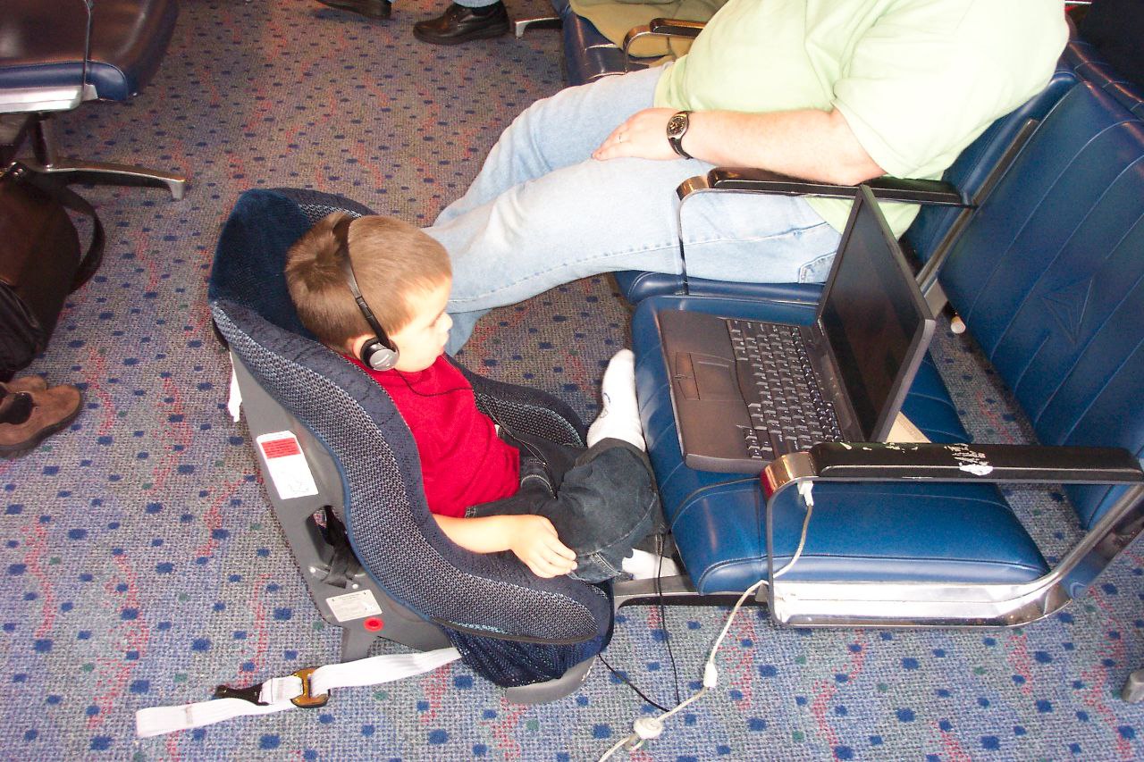 Me in an airport at around maybe the age of 3 watching TV on a laptop